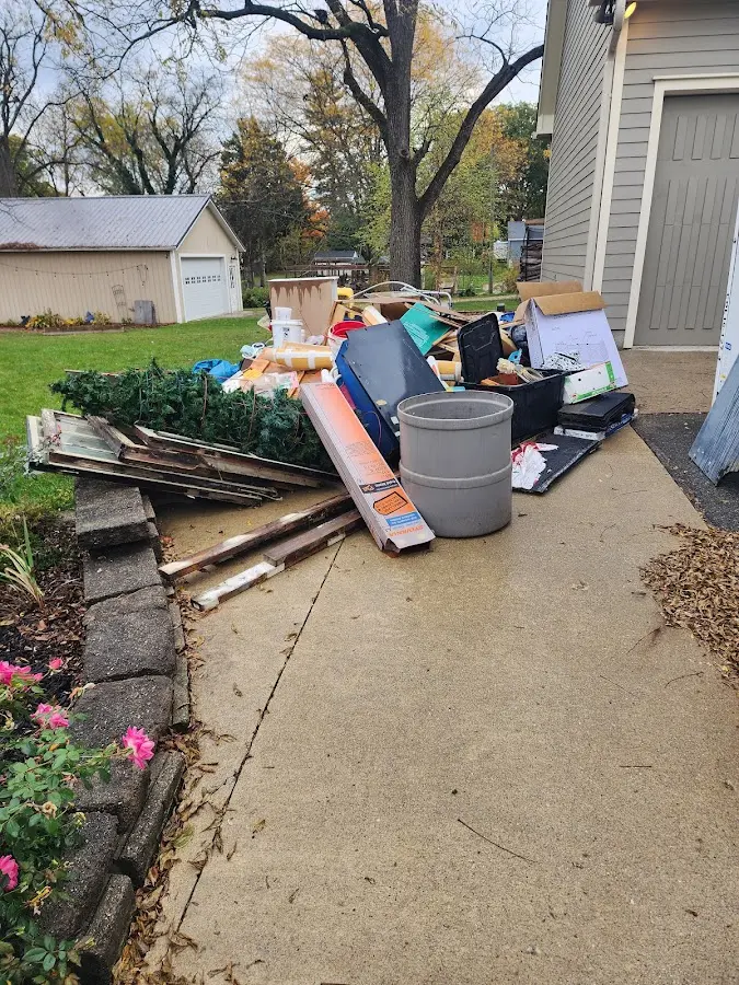 Dumpster being loaded with debris for 3 Yard Dumpster Rental in Richland Center